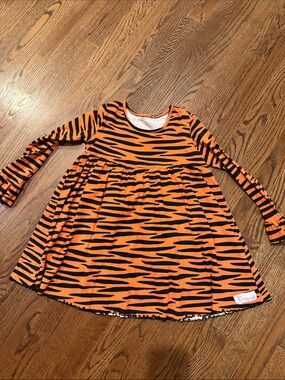 Flowersak boutique orange and black tiger print ruffle cuff dress 6/7